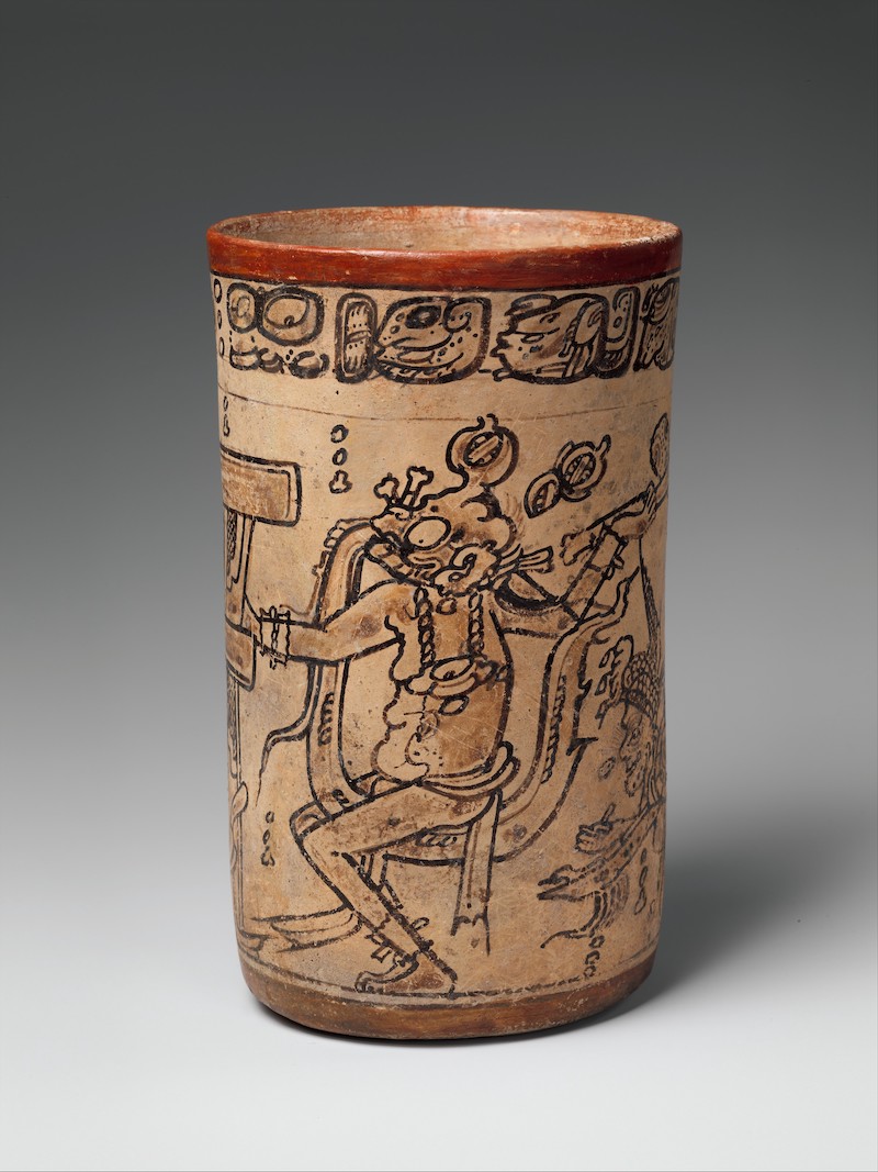 Cup inscribed with a figure holding a ceremonial ax in one hand. 