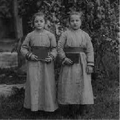 Abdul-Hamid II Collection Detail: Black and white photograph of two girls in dresses standing in front of a tree
