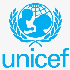 UNICEF The image shows the UNICEF logo depicting in solid blue a parent holding a child in front of a sphere marked with latitude and longitude lines representing the globe.