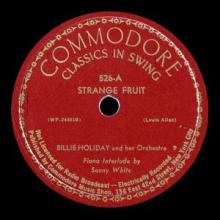 The label on a vinyl copy of Strange Fruit. Circular label is red with Commodore: classics in swing at the top and the title Strange Fruit.